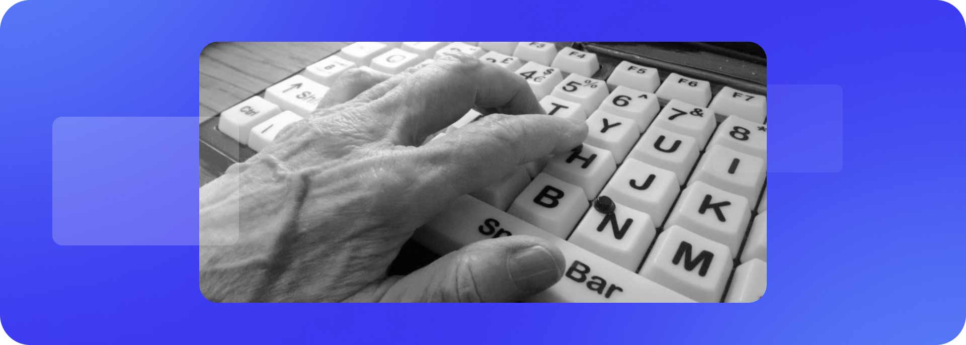 Old person’s hand on adaptive/accessible keyboard