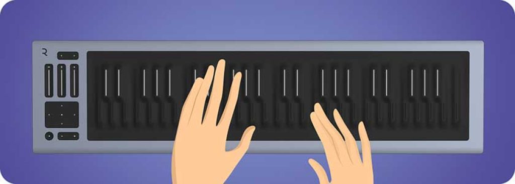 A blind person using a Braille music keyboard to create and play music.