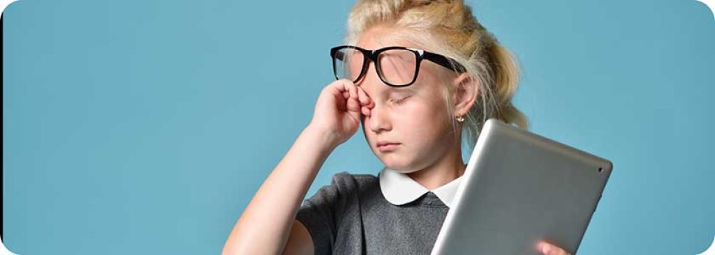 child wearing big glasses using tablet